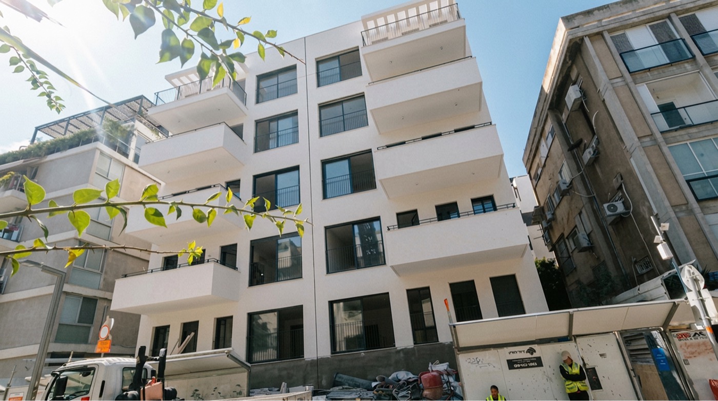 The White City Sanctuary in Tel Aviv: a renovated white Bauhaus-style apartment building with rounded balconies